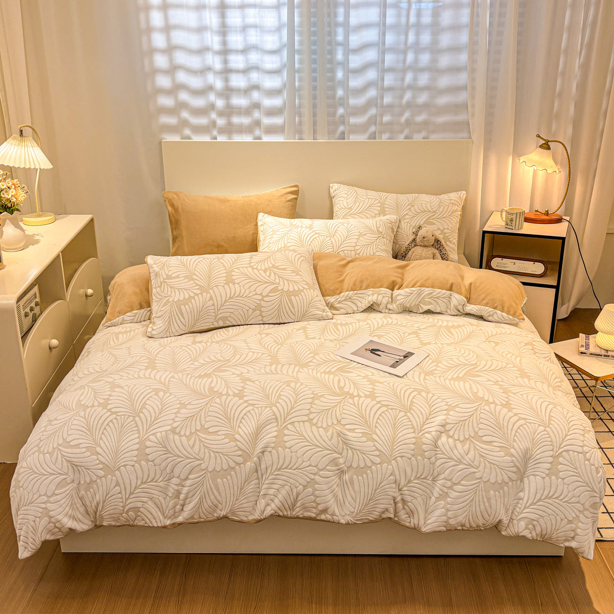 Brown Fleurie floral bedding with delicate leafy pattern on a made bed
