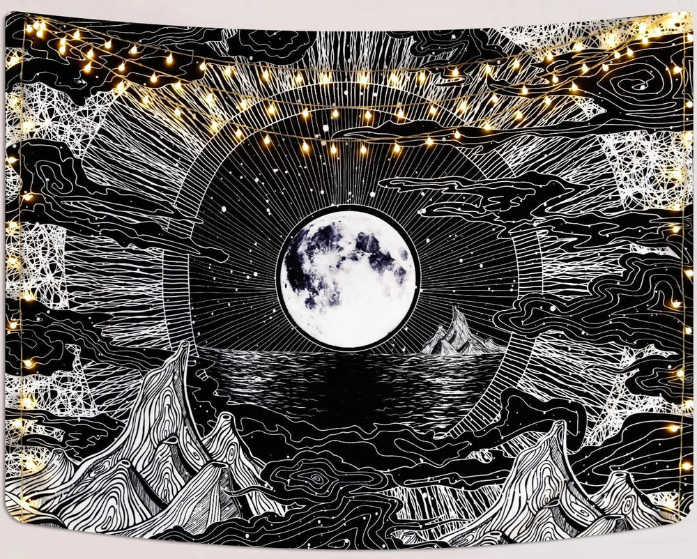 Black-and-white mountain tapestry with a full moon and radiating stars