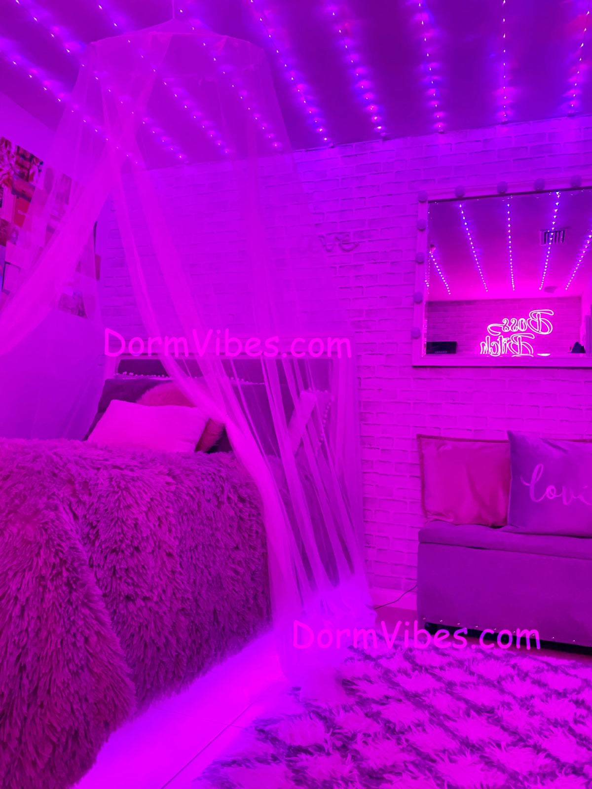 Pink ceiling light strands in a bedroom with a canopy bed