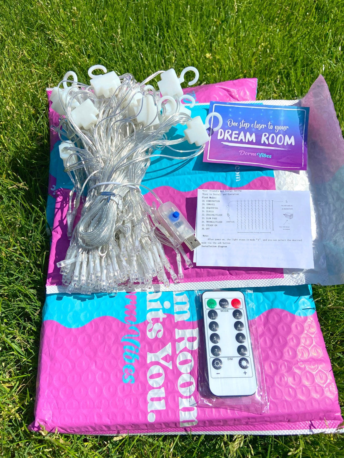 Warm white curtain light set with remote, instructions and packaging