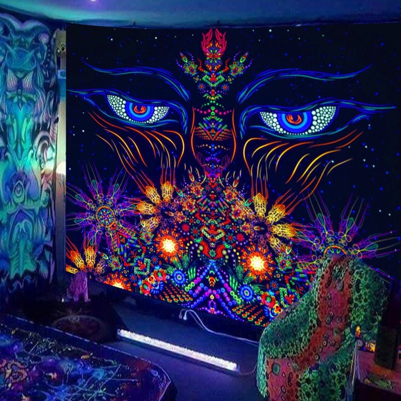 Two large eyes above a colorful abstract landscape on a black tapestry