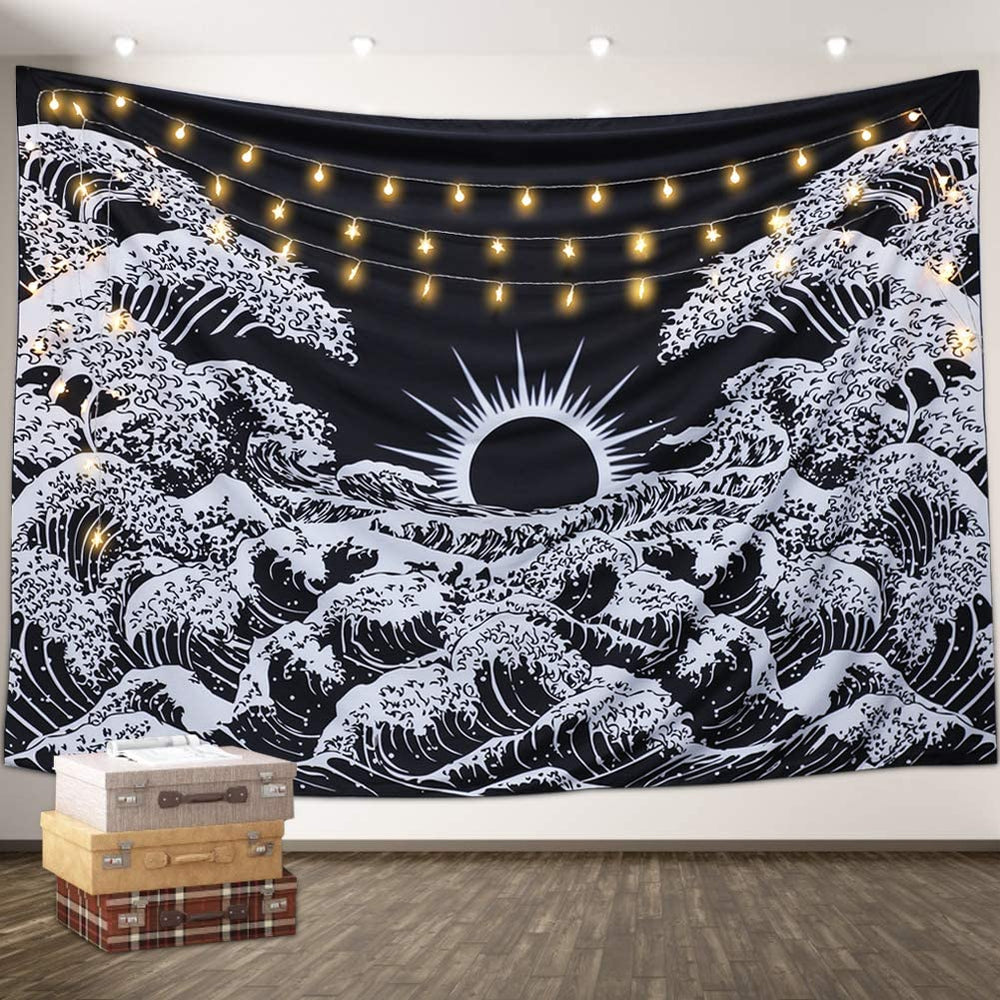 White ocean waves on a black tapestry with a sun at the horizon