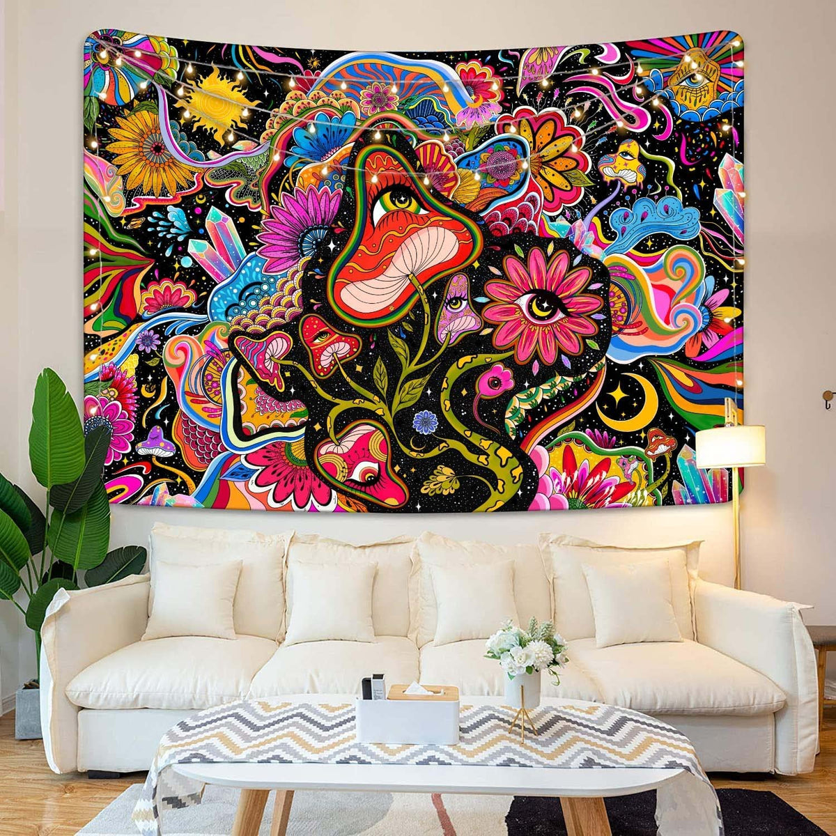 Psychedelic mushroom tapestry behind a white living room sofa
