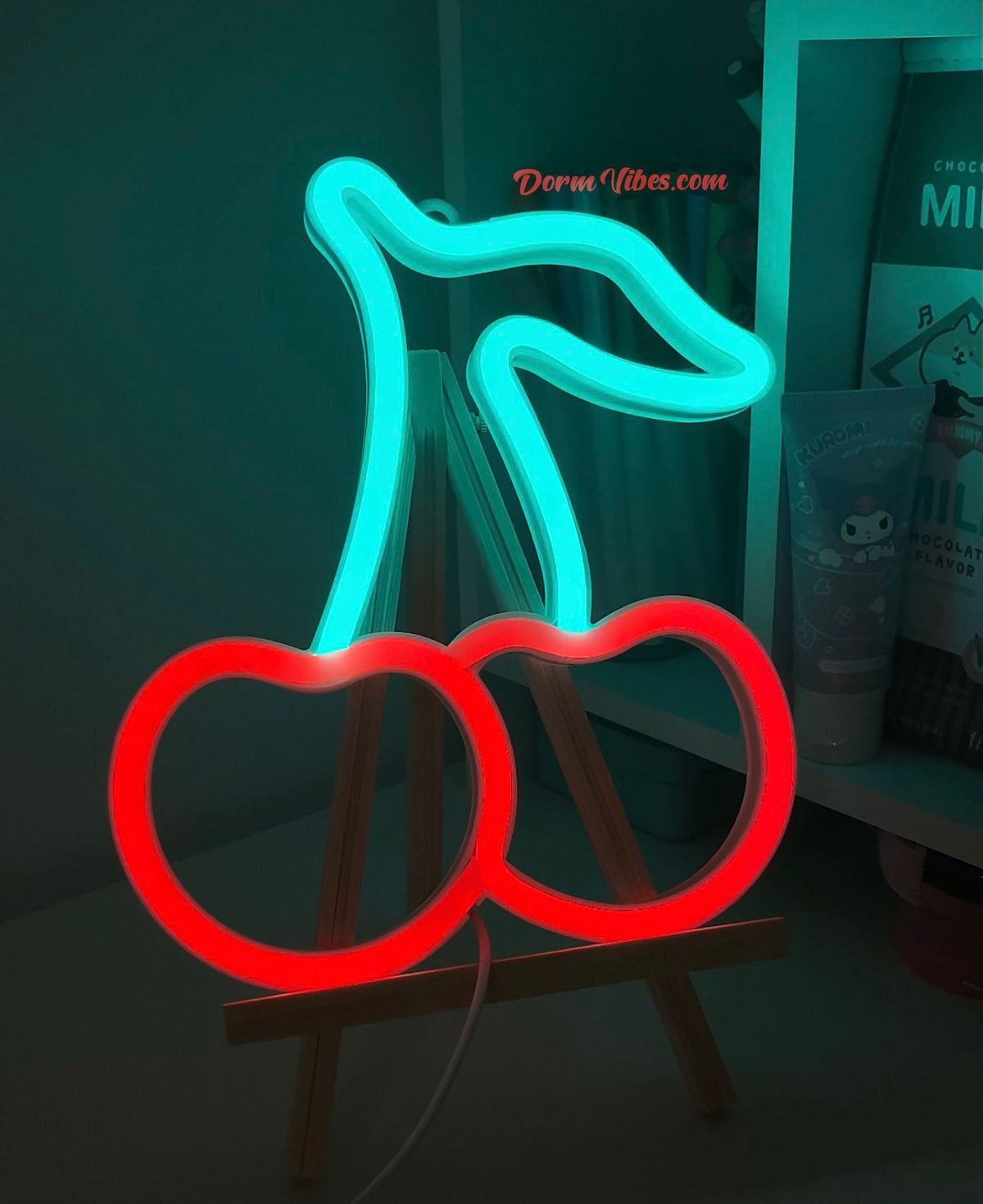 Red cherry neon sign with turquoise stems and leaf