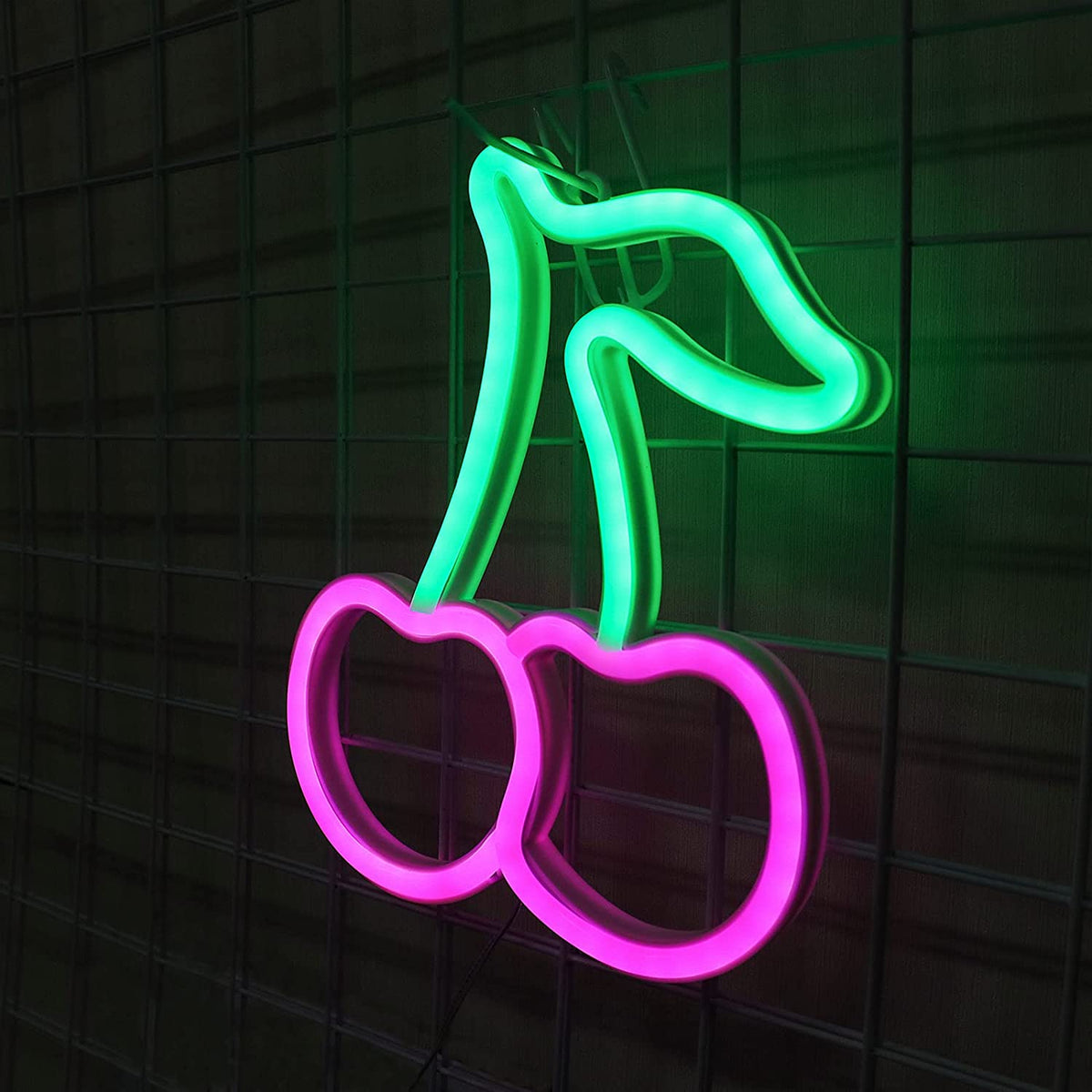 Pink cherry neon sign with green stems on a wire grid