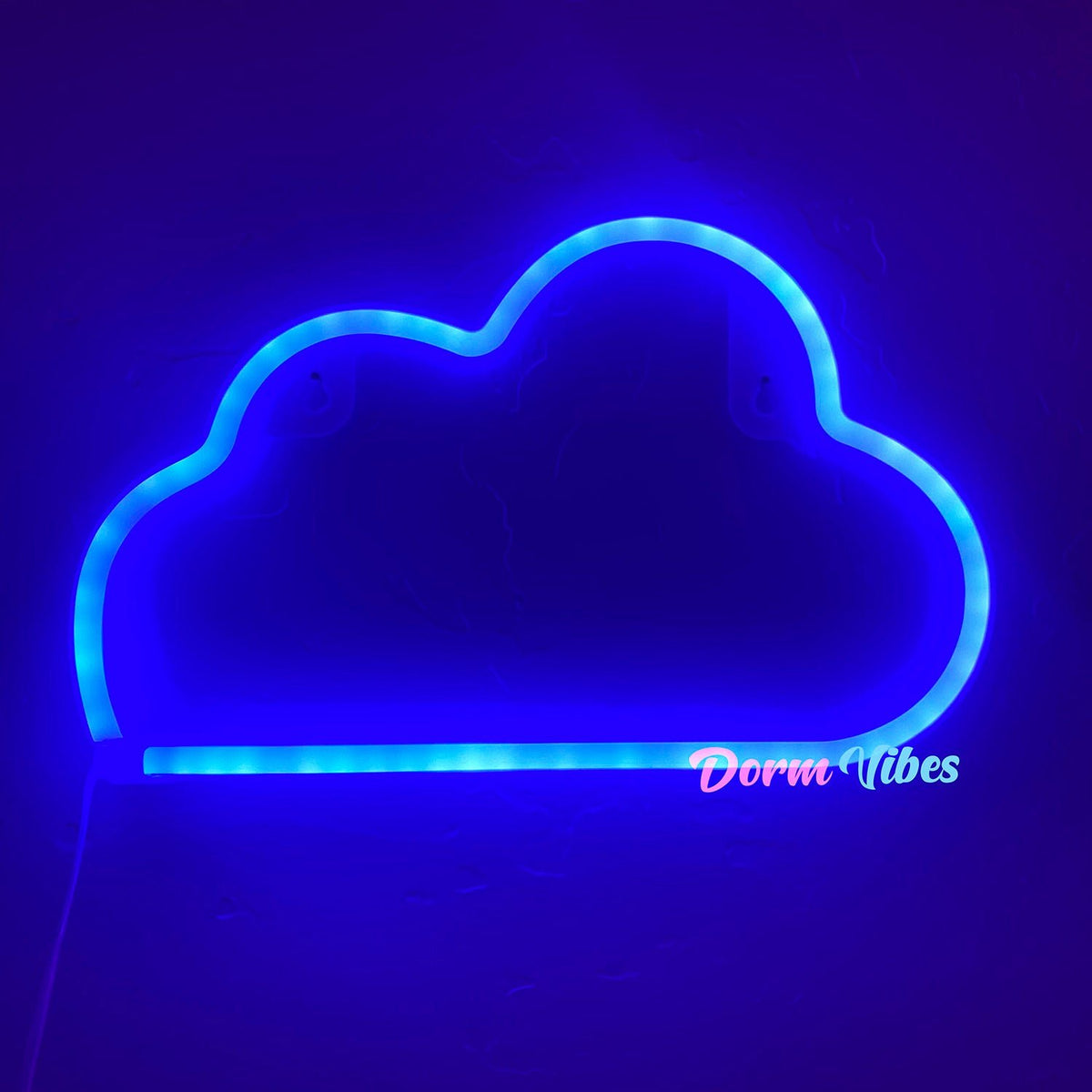 Blue cloud-shaped neon sign glowing against a dark wall