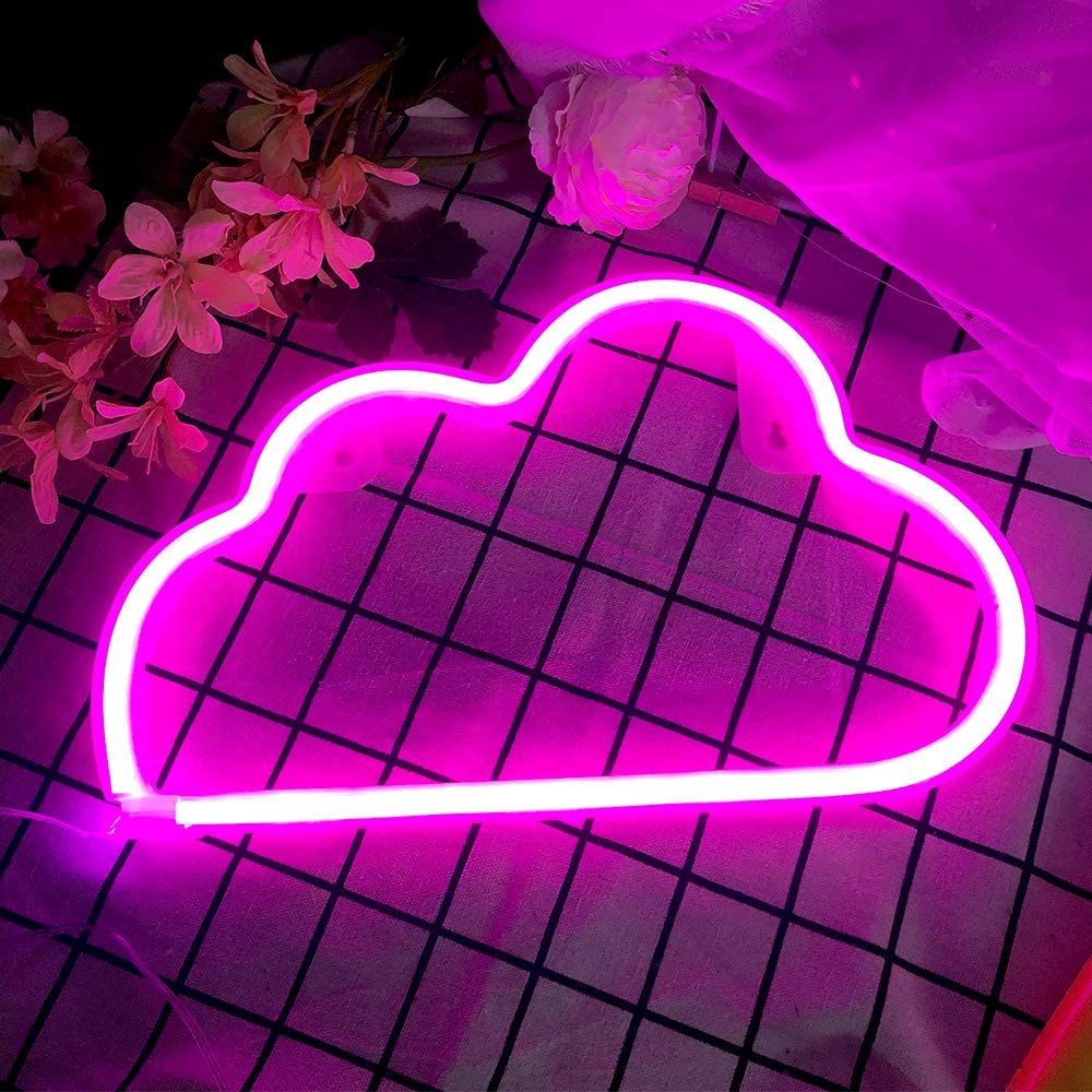 Pink cloud neon sign displayed on a black wire grid