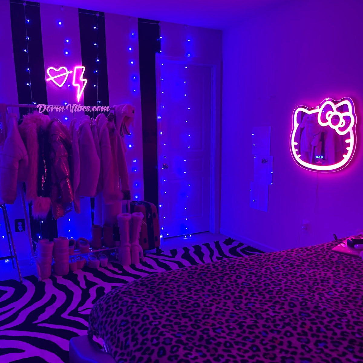 Heart and lightning bolt neon signs beside blue bedroom lights