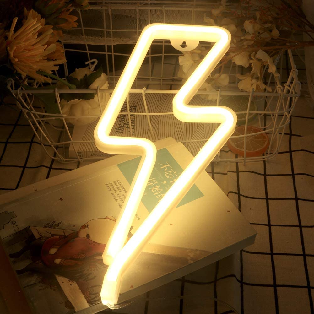 Warm white lightning bolt neon sign on a wire grid