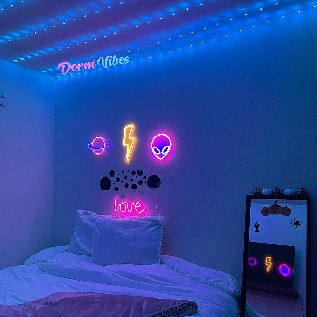 Yellow lightning bolt sign above a bed beneath blue ceiling lights