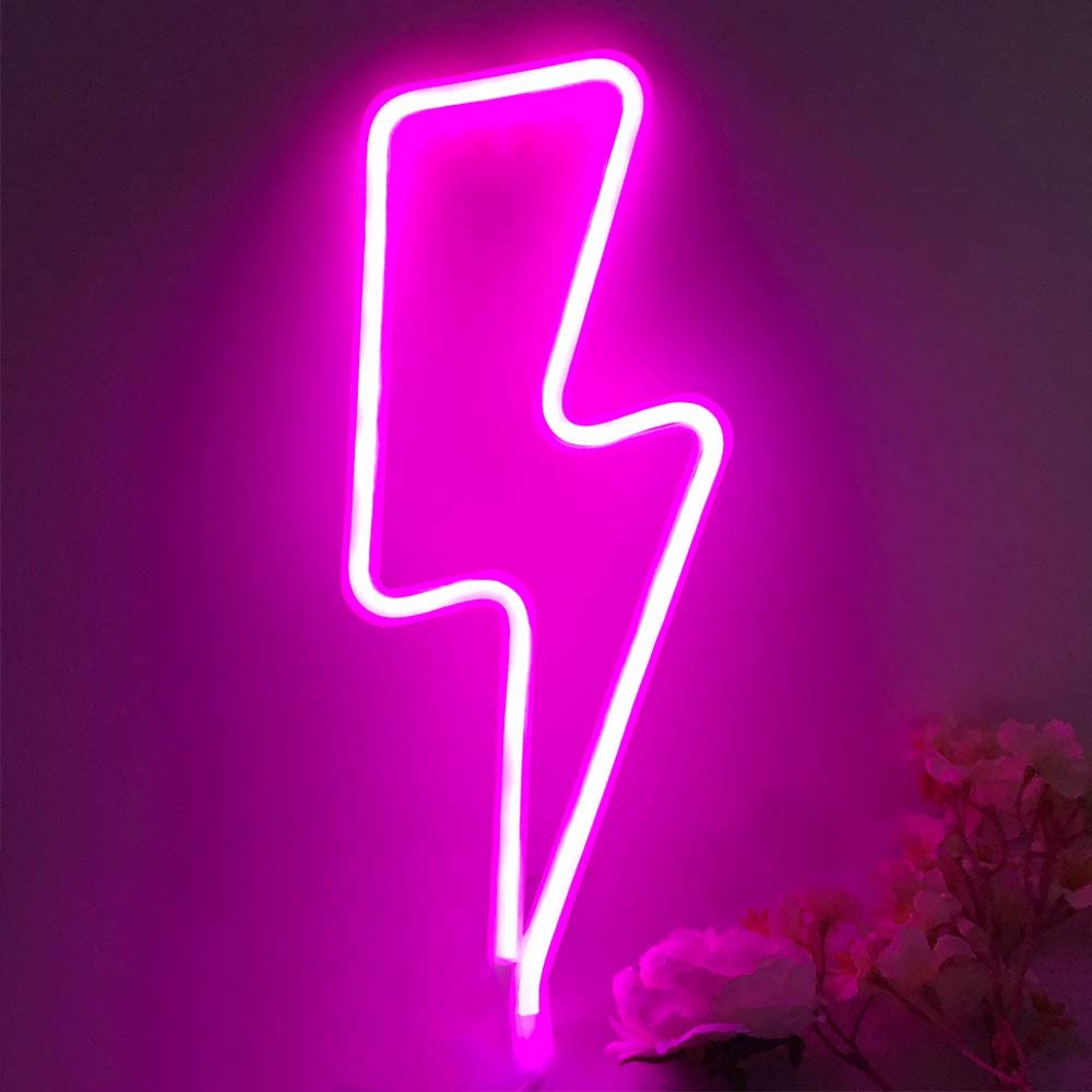 Pink lightning bolt neon sign glowing against a wall