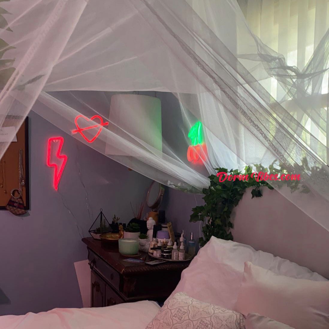 Red lightning bolt wall sign beside a bedroom canopy