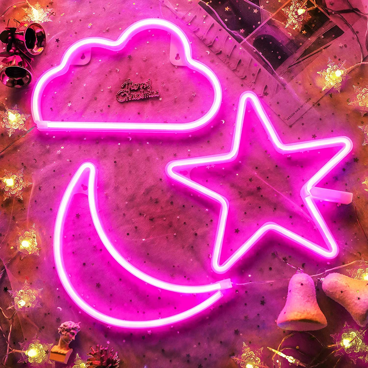 Pink cloud, crescent moon and star neon signs on a decorated grid