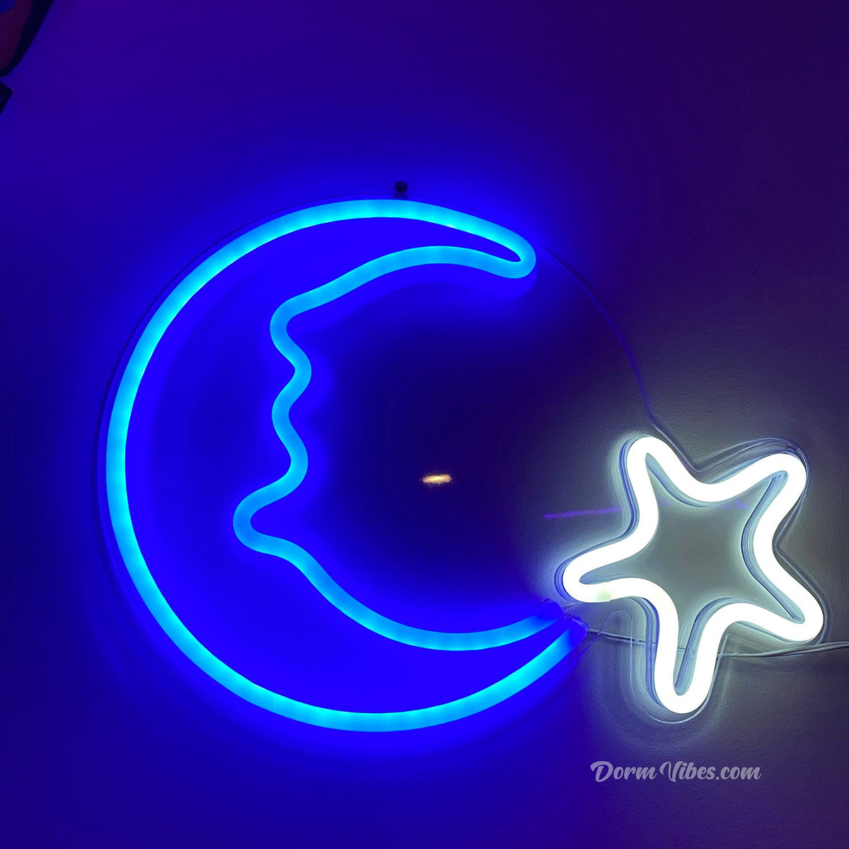 Blue crescent moon face neon sign with a white star