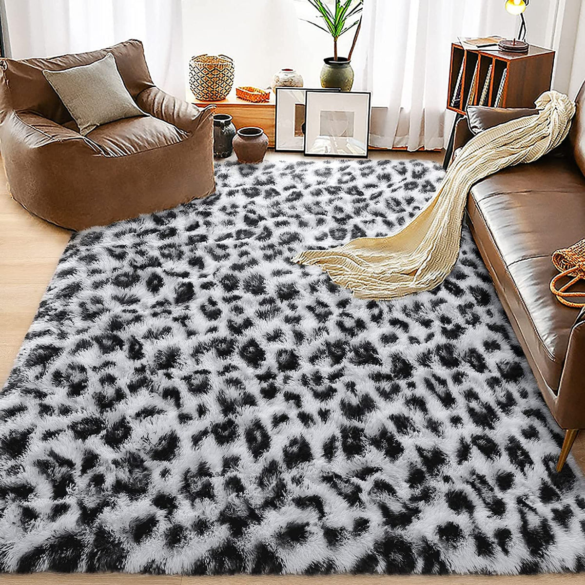 Black-and-white leopard-print rug between living room chairs