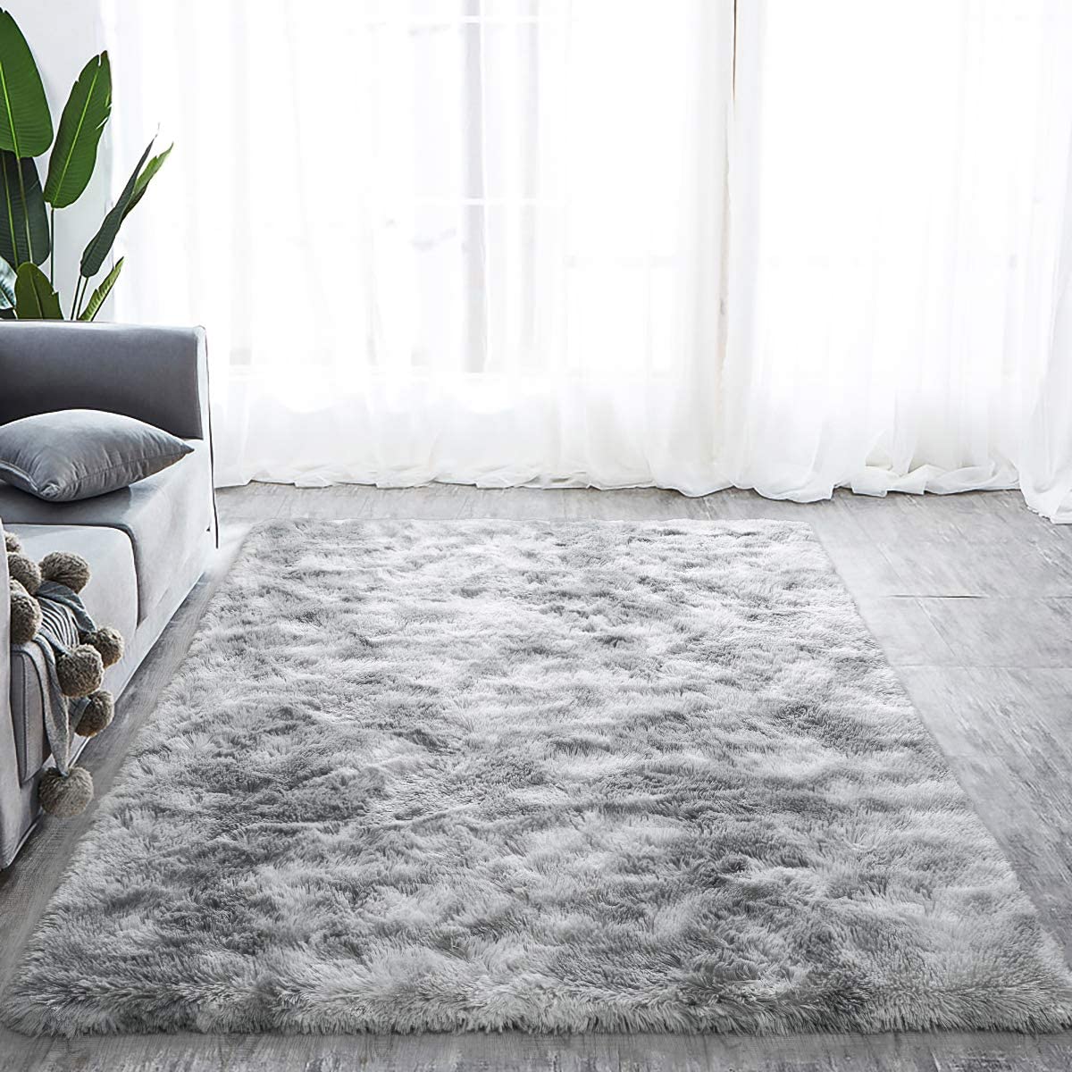 Gray and white tie-dye shaggy rug in a bright living room