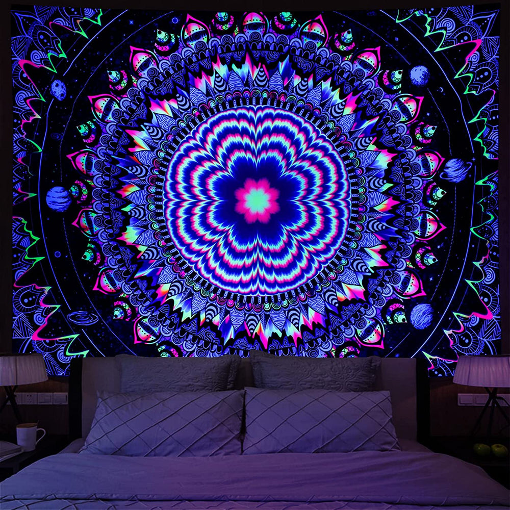 Blue and purple floral mandala tapestry above a bed
